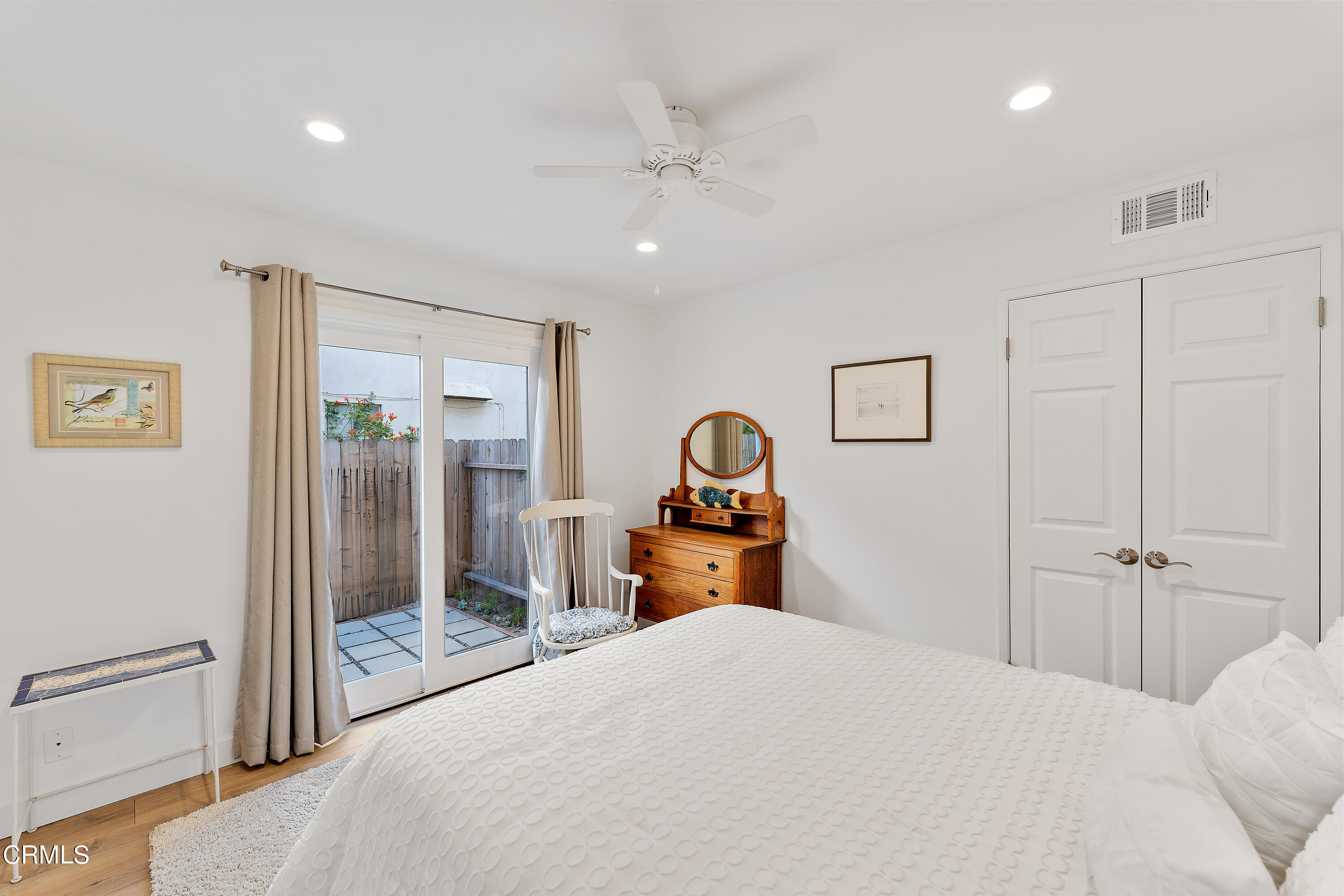 5207 Sealane Way Oxnard, CA 93035 - Photo 21 of 45 a bedroom with a bed and a large mirror