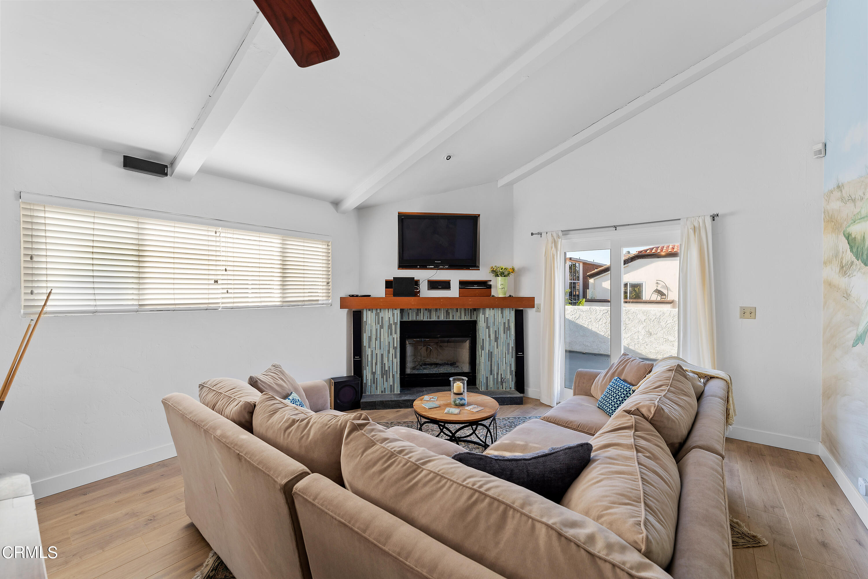 5207 Sealane Way Oxnard, CA 93035 - Photo 26 of 45 a living room with furniture a fireplace and a flat screen tv