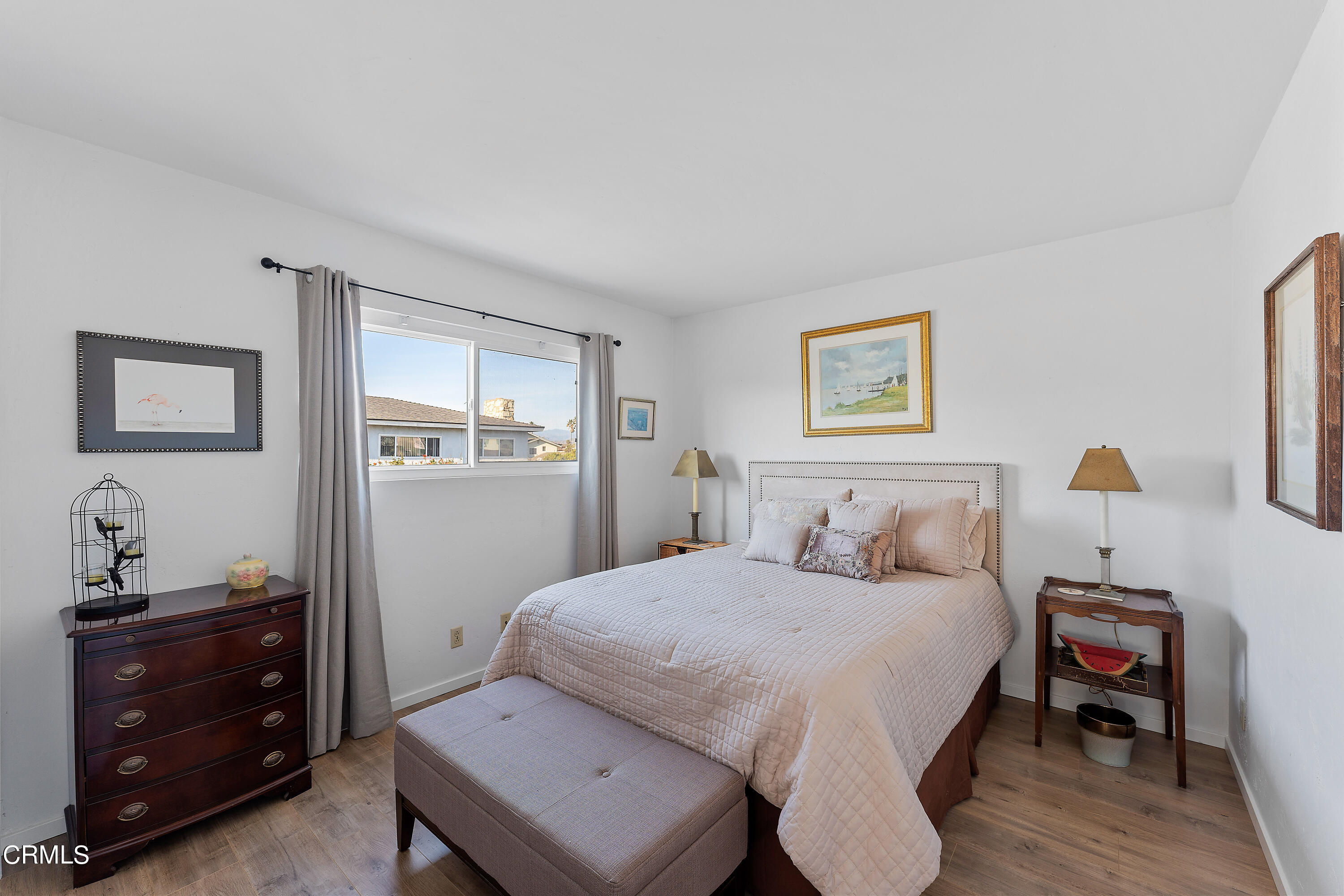 5207 Sealane Way Oxnard, CA 93035 - Photo 28 of 45 a bedroom with a bed and a dresser in it