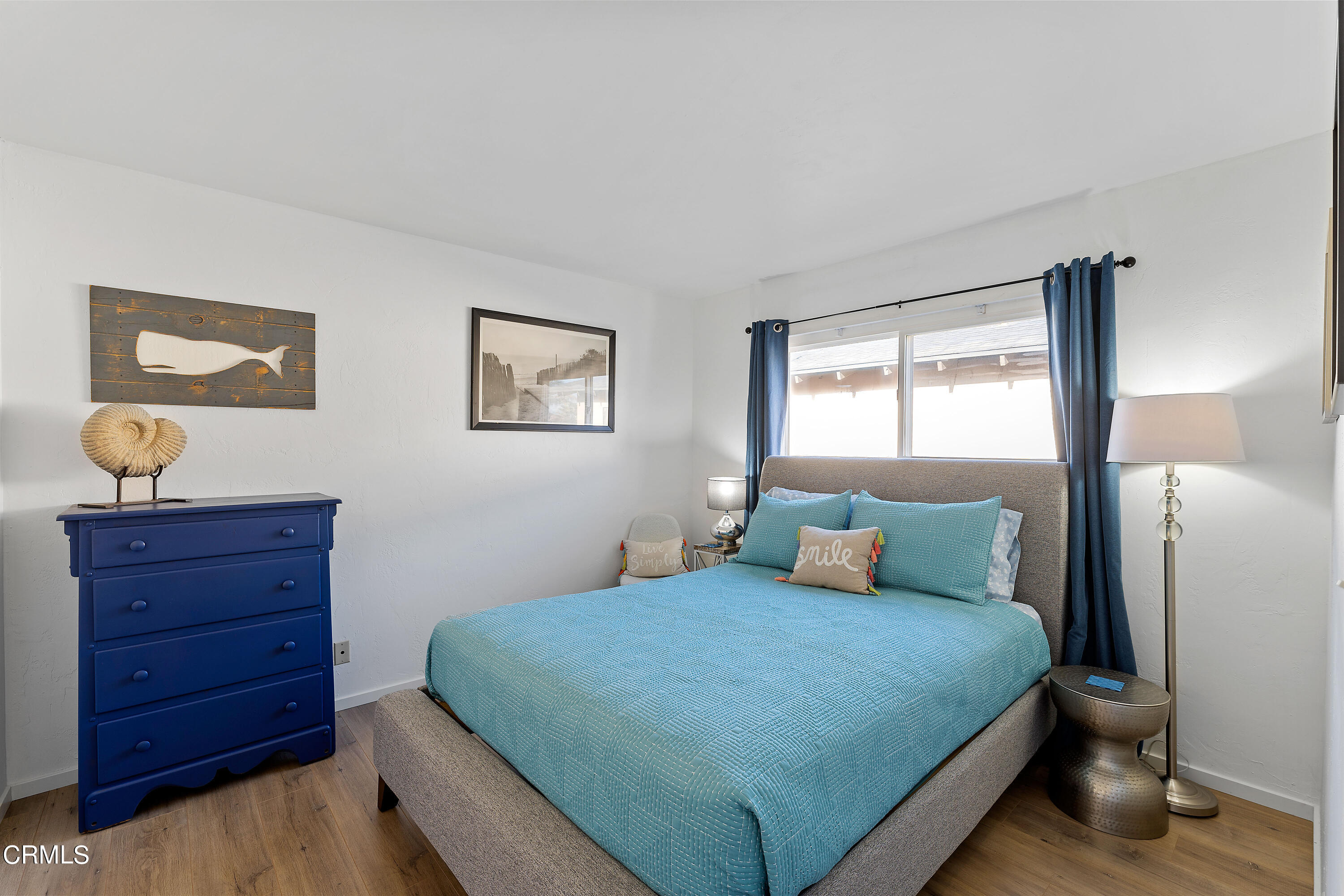 5207 Sealane Way Oxnard, CA 93035 - Photo 29 of 45 a bedroom with a bed and window