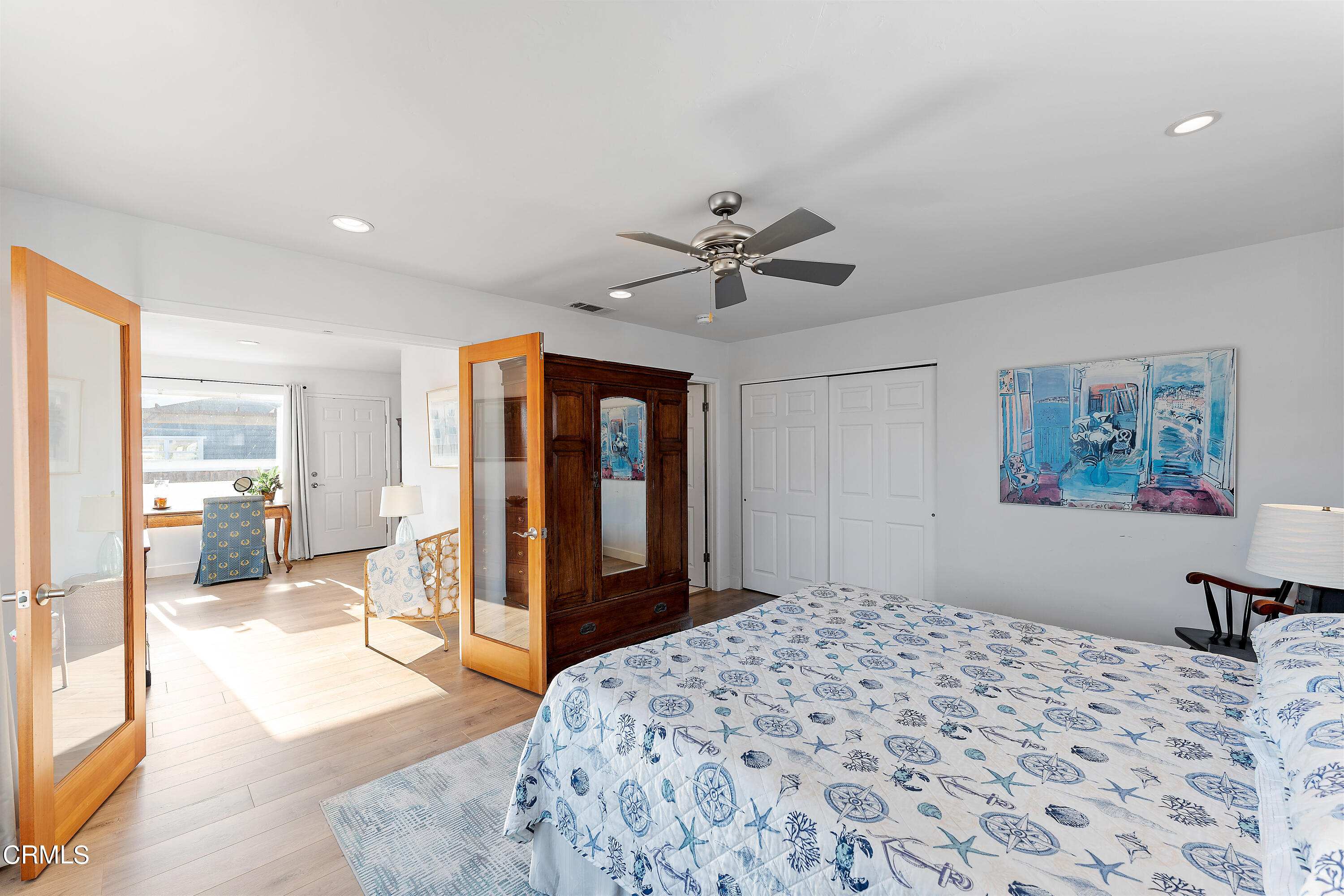 5207 Sealane Way Oxnard, CA 93035 - Photo 35 of 45 a bedroom with a large bed a flat tv screen and furniture