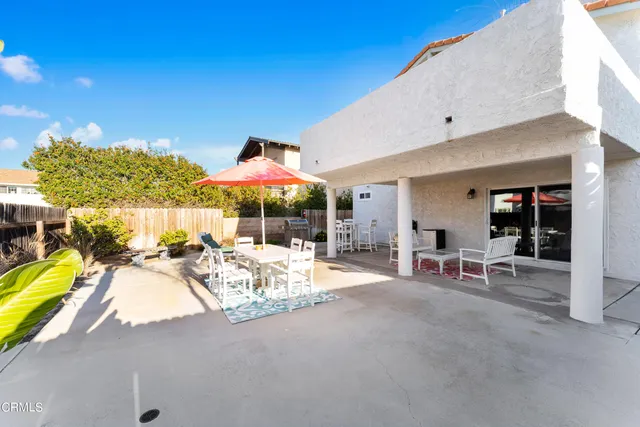 a view of a patio with swimming pool table and chairs