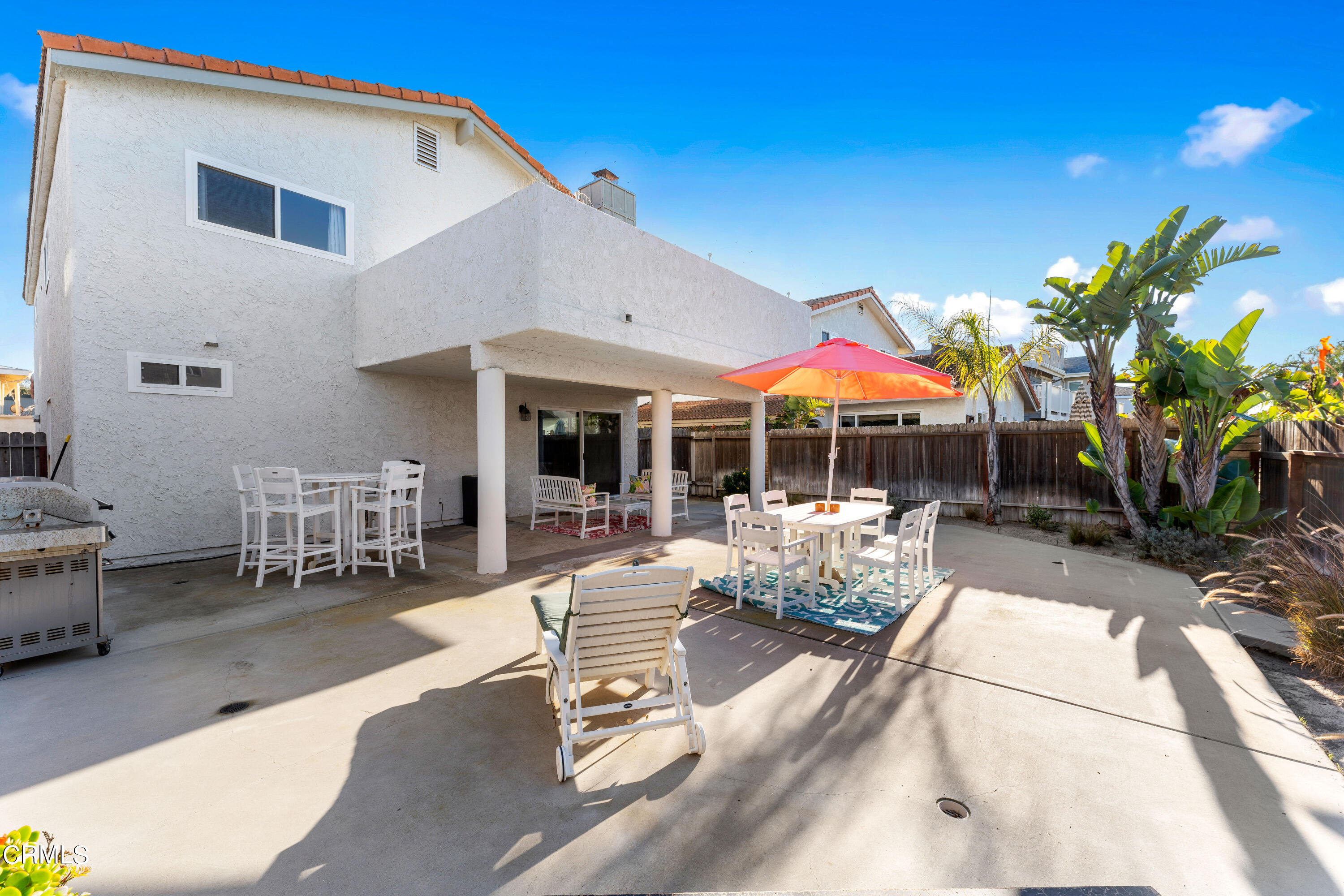 5207 Sealane Way Oxnard, CA 93035 - Photo 43 of 45 a view of patio with a table and chairs under an umbrella