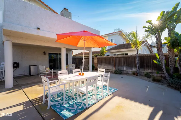 a view of a backyard with sitting area