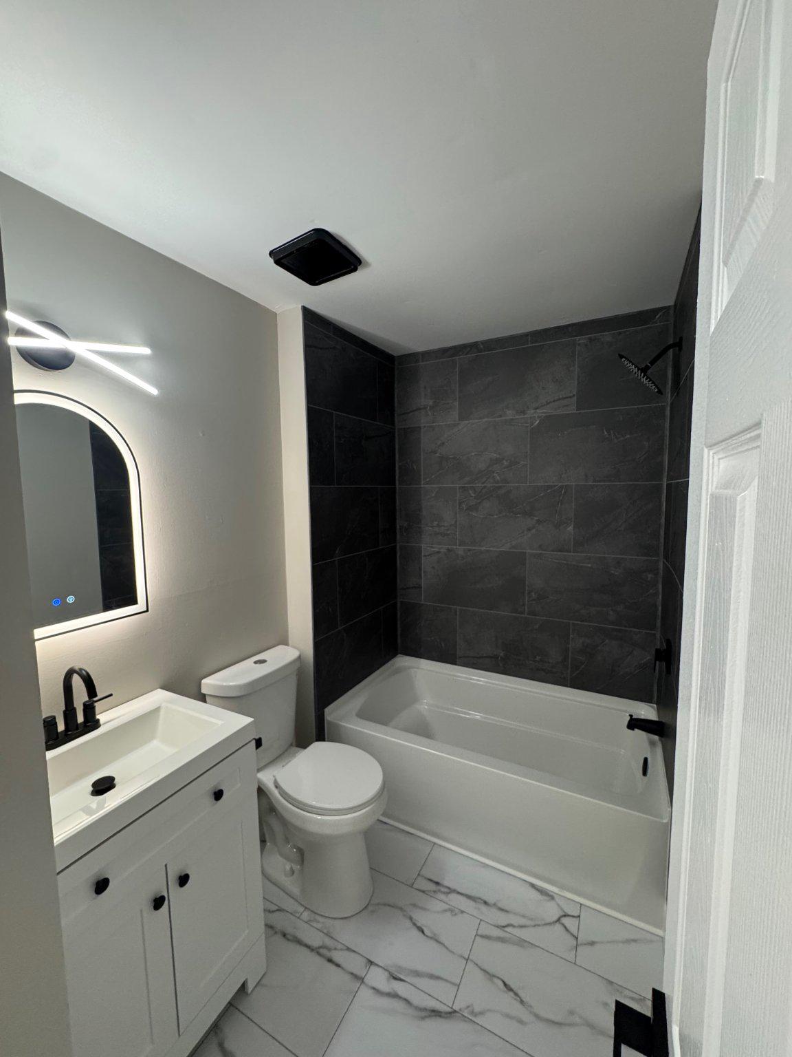 8 Framingham Road Beverly, NJ 08010 - Photo 17 of 35 a bathroom with a bathtub shower sink vanity and toilet