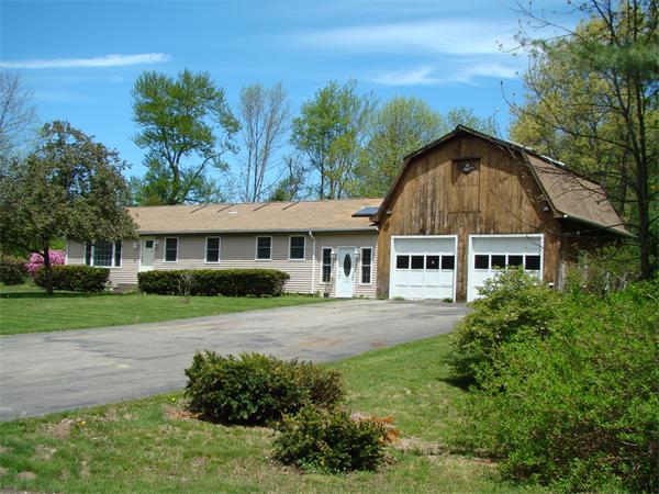 a house view with a garden space