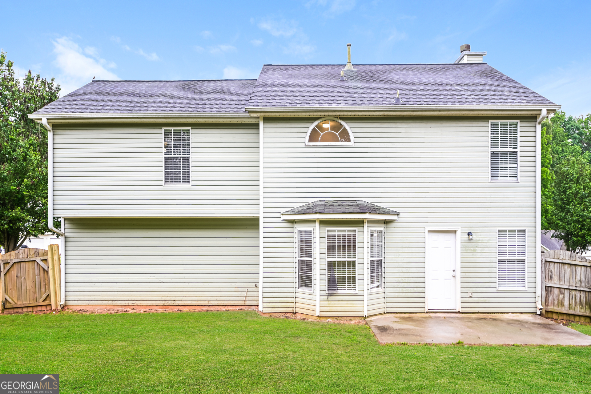 10253 Commons Crossing Jonesboro, GA 30238 - Photo 15 of 17 a front view of a house with a yard