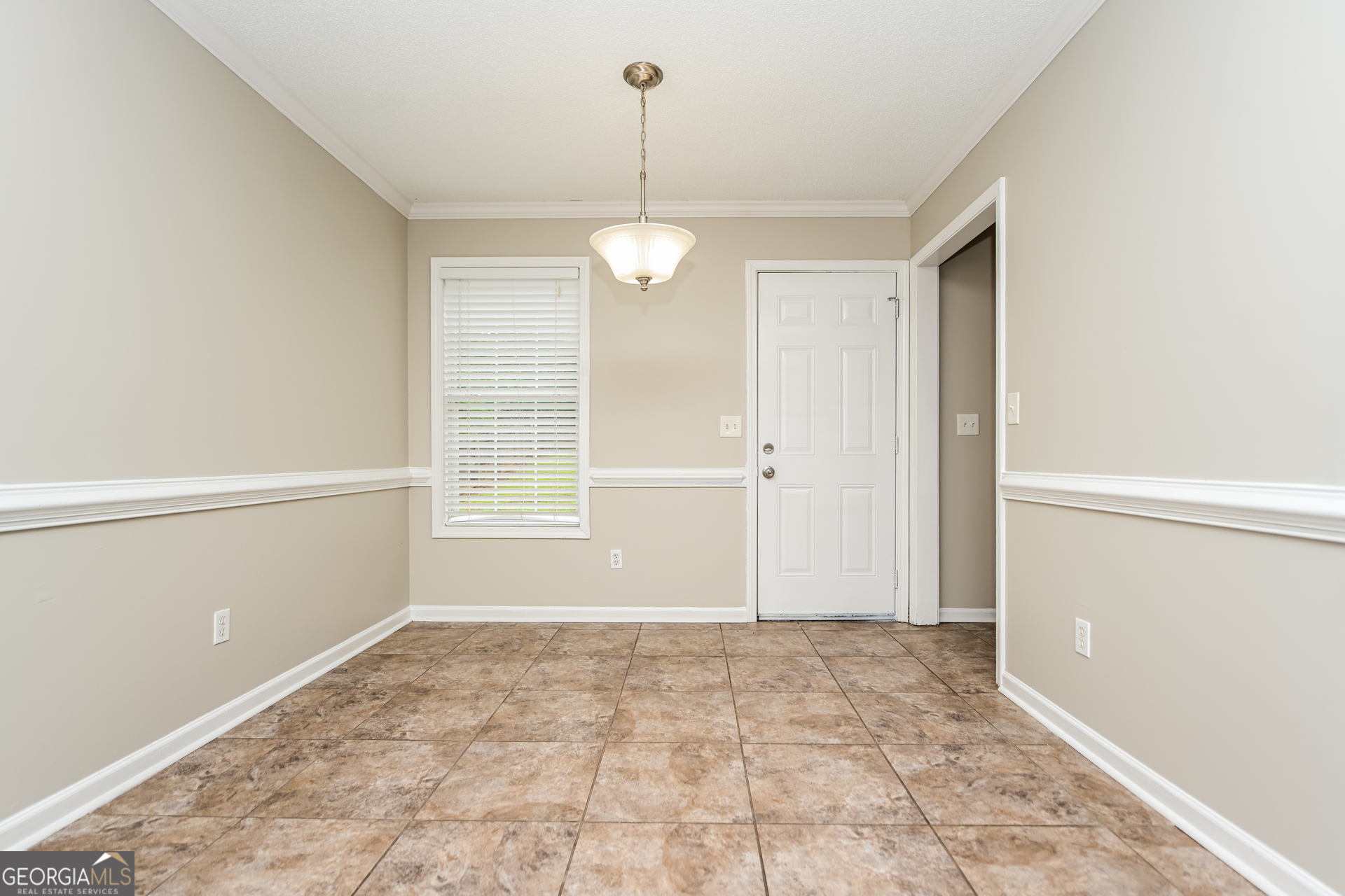10253 Commons Crossing Jonesboro, GA 30238 - Photo 3 of 17 a view of an empty room with a window
