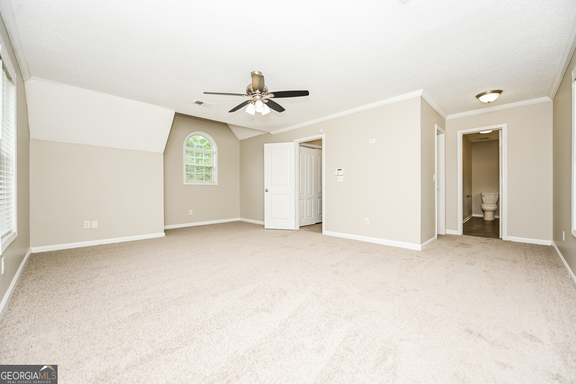 10253 Commons Crossing Jonesboro, GA 30238 - Photo 6 of 17 a view of empty room with windows