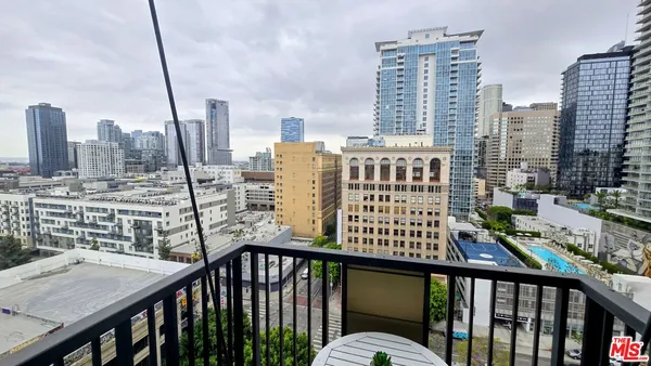 a view of a balcony with city view