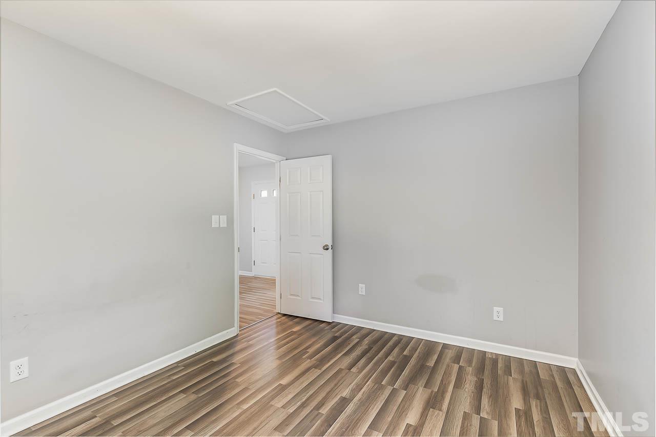 5708 Brandycrest Drive Raleigh, NC 27610 - Photo 17 of 31 a view of room with window and wooden floor