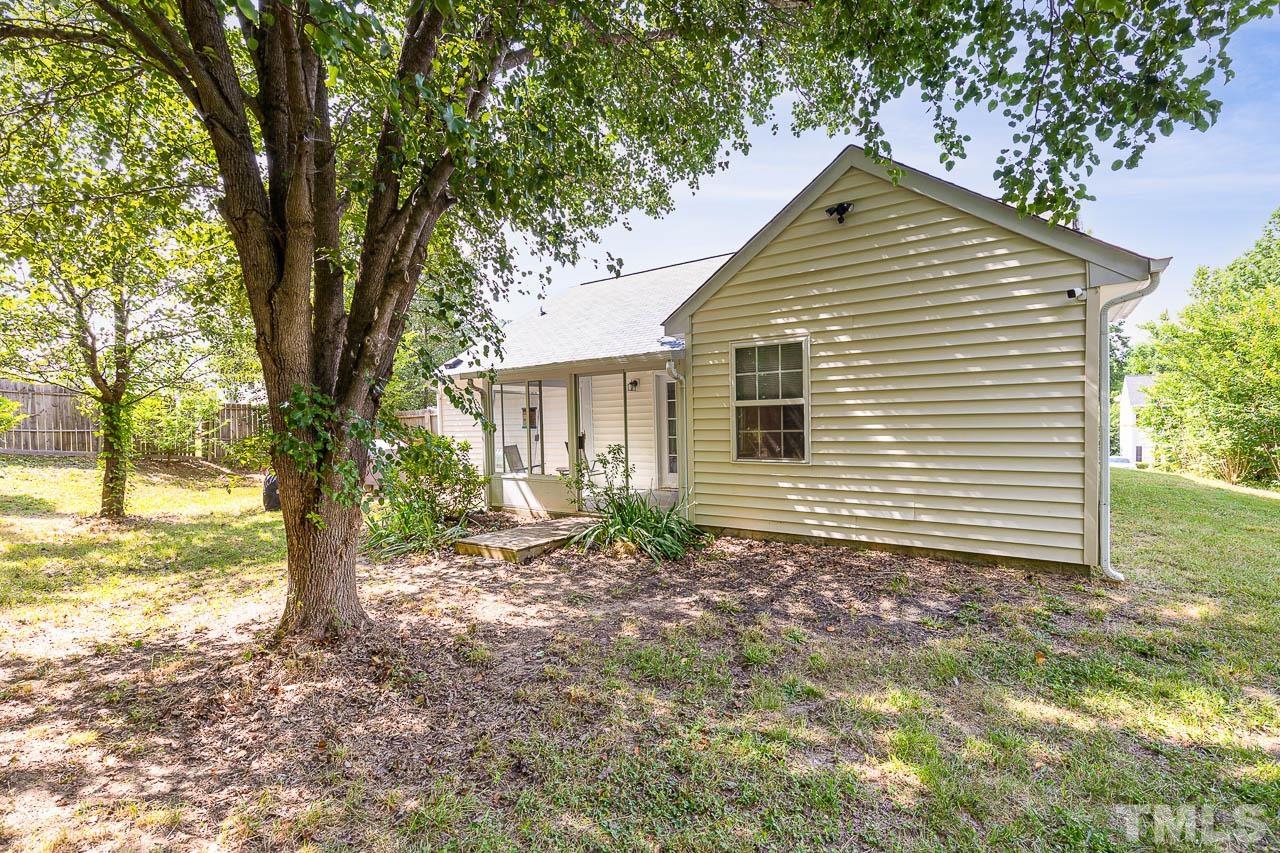 5708 Brandycrest Drive Raleigh, NC 27610 - Photo 23 of 31 a view of a house with a yard