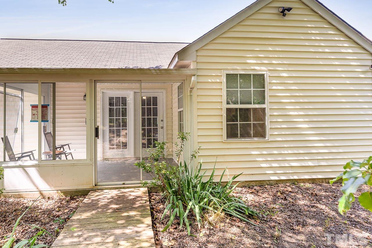 5708 Brandycrest Drive Raleigh, NC 27610 - Photo 24 of 31 a view of a house with a backyard