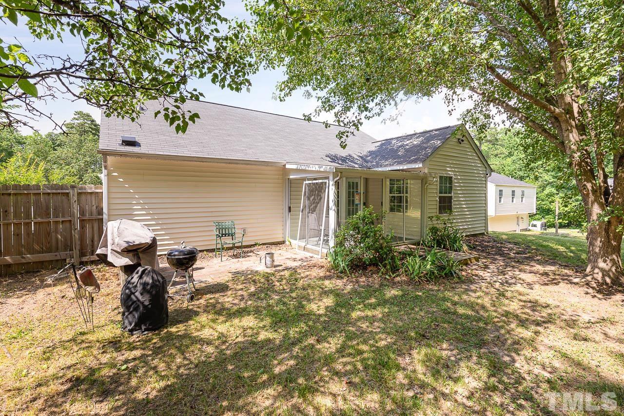 5708 Brandycrest Drive Raleigh, NC 27610 - Photo 26 of 31 a view of house with backyard space and garden