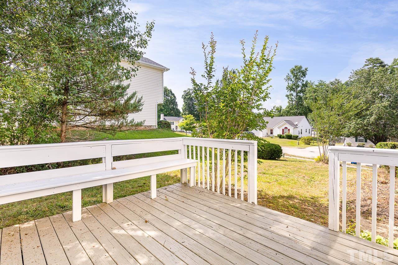 5708 Brandycrest Drive Raleigh, NC 27610 - Photo 27 of 31 a view of a balcony with wooden floor and fence
