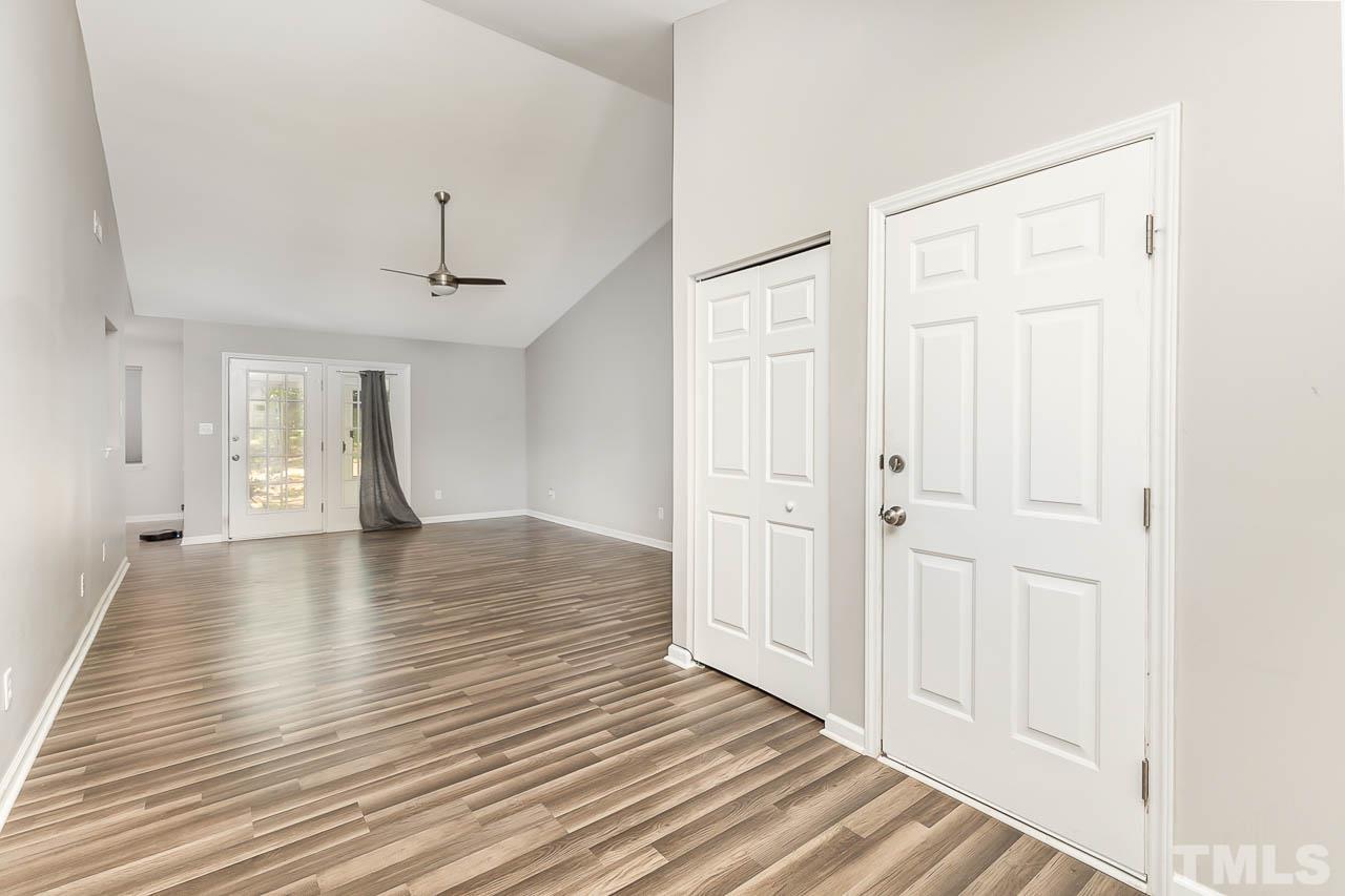 5708 Brandycrest Drive Raleigh, NC 27610 - Photo 4 of 31 a view of empty room with wooden floor