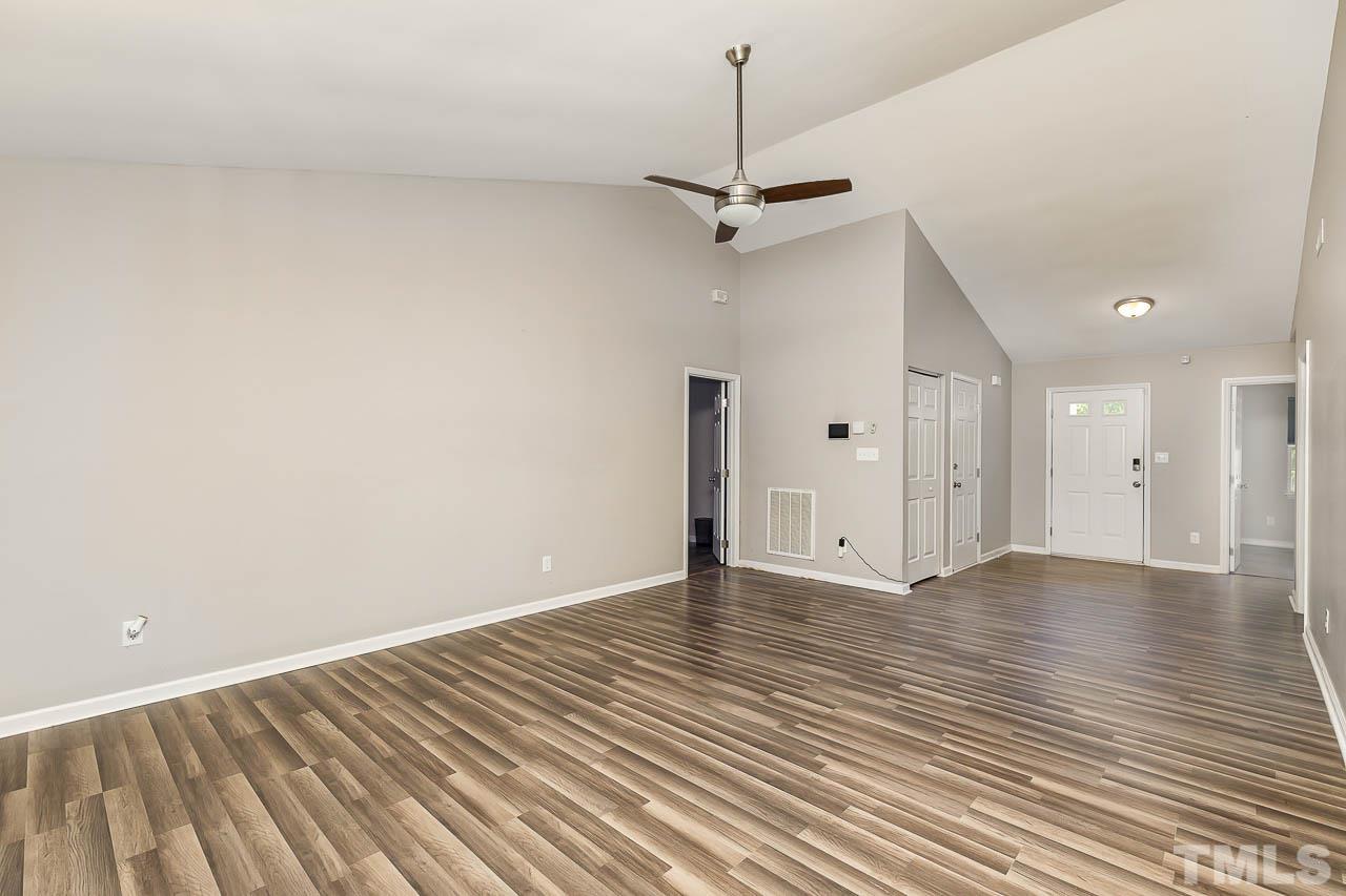 5708 Brandycrest Drive Raleigh, NC 27610 - Photo 5 of 31 a view of an empty room with a window