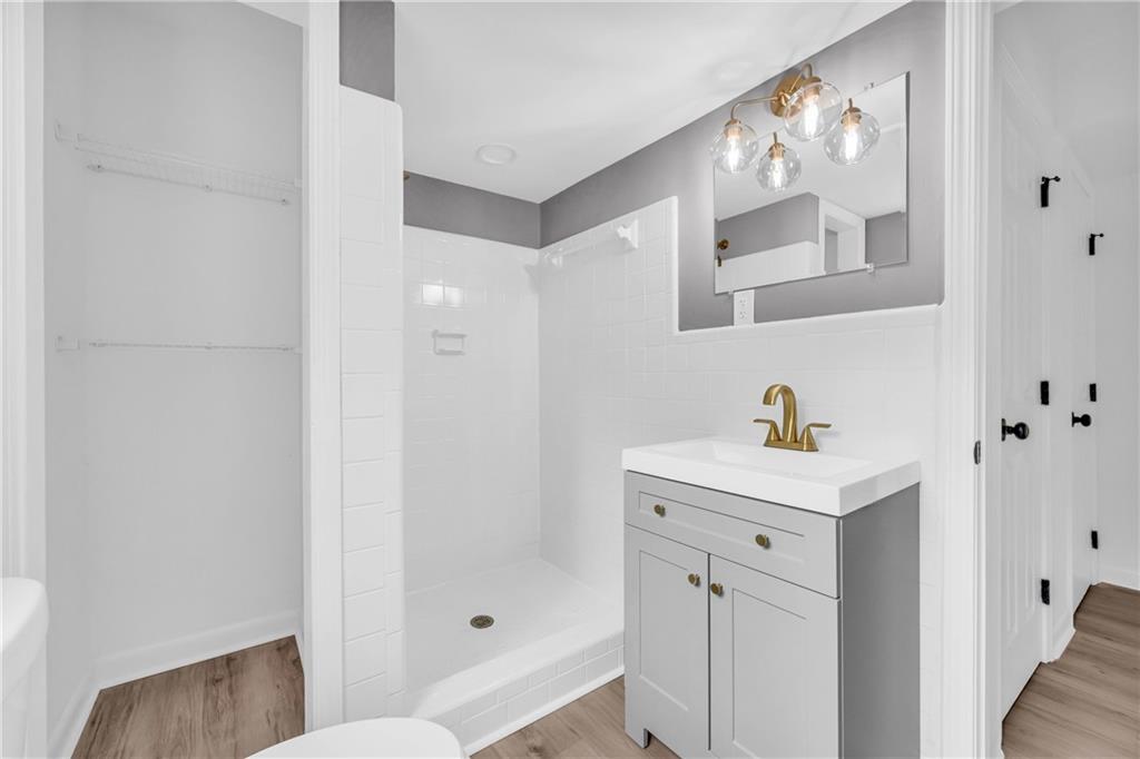 2678 Rainbow Forest Drive Decatur, GA 30034 - Photo 25 of 48 a bathroom with a sink and mirror with toilet