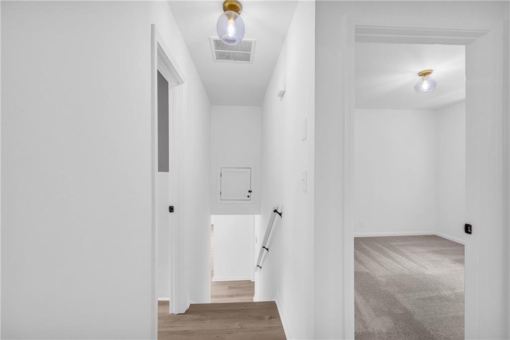2678 Rainbow Forest Drive Decatur, GA 30034 - Photo 28 of 48 a view of a hallway with white walls and stairs