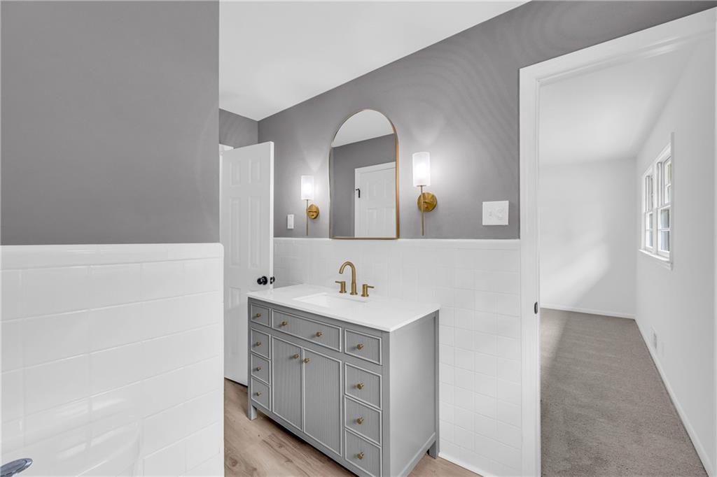 2678 Rainbow Forest Drive Decatur, GA 30034 - Photo 31 of 48 a bathroom with a double vanity sink and a mirror