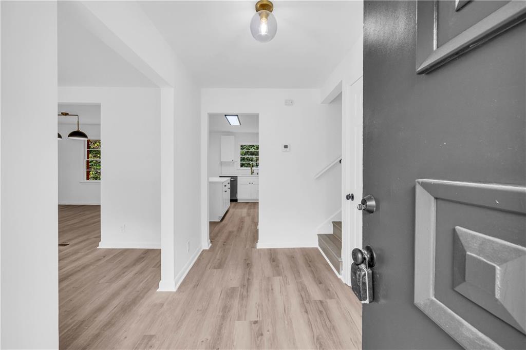 2678 Rainbow Forest Drive Decatur, GA 30034 - Photo 6 of 48 a view of a livingroom with wooden floor and a fireplace