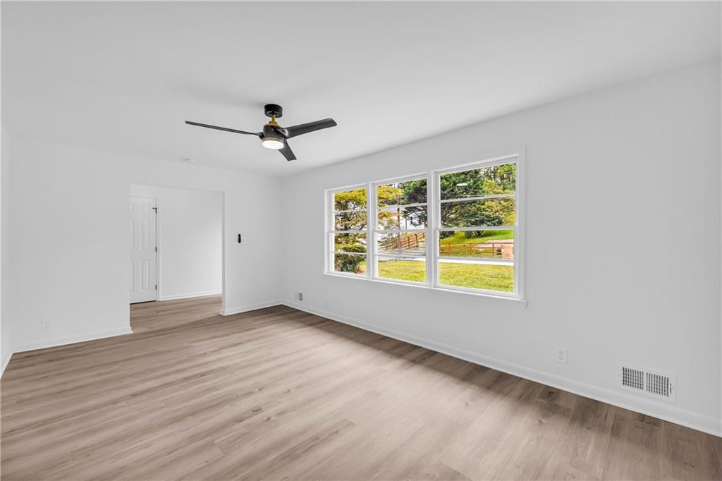 2678 Rainbow Forest Drive Decatur, GA 30034 - Photo 10 of 48 wooden floor in an empty room with a window
