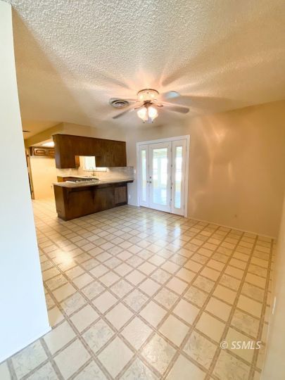516 West Wasp Avenue Ridgecrest, CA 93555 - Photo 4 of 25 a view of a living room and chandelier