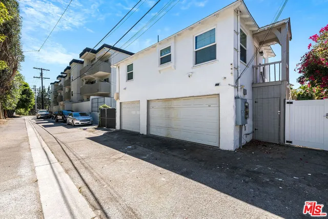 a view of a house with a street
