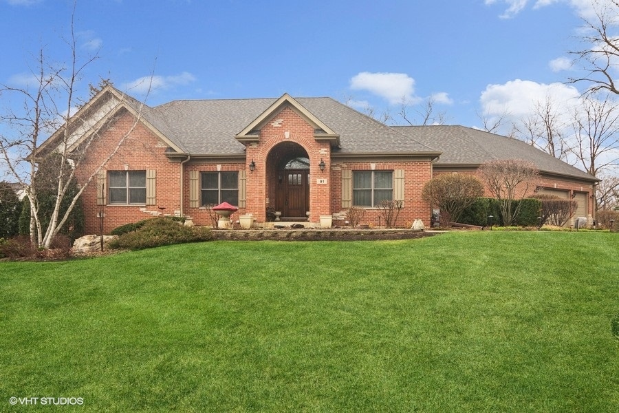 91 Roberts Road Inverness, IL 60067 - Photo 1 of 36 a front view of house with yard and green space