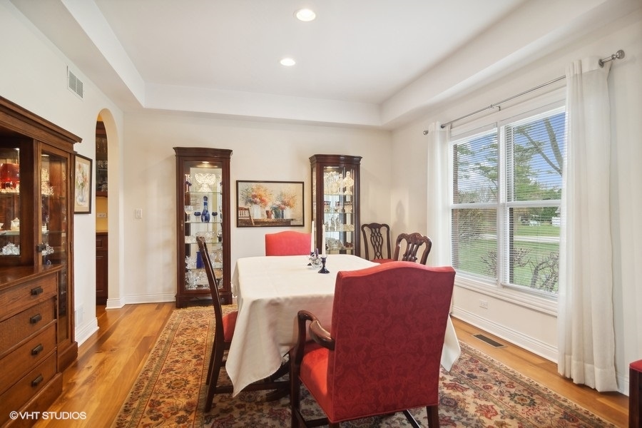 91 Roberts Road Inverness, IL 60067 - Photo 11 of 36 a view of a dining room with furniture window and wooden floor
