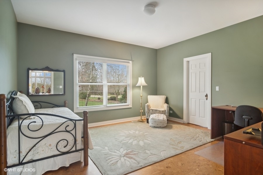 91 Roberts Road Inverness, IL 60067 - Photo 15 of 36 a bedroom with a bed and window