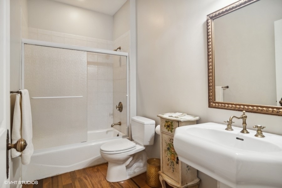 91 Roberts Road Inverness, IL 60067 - Photo 16 of 36 a bathroom with a sink toilet and shower