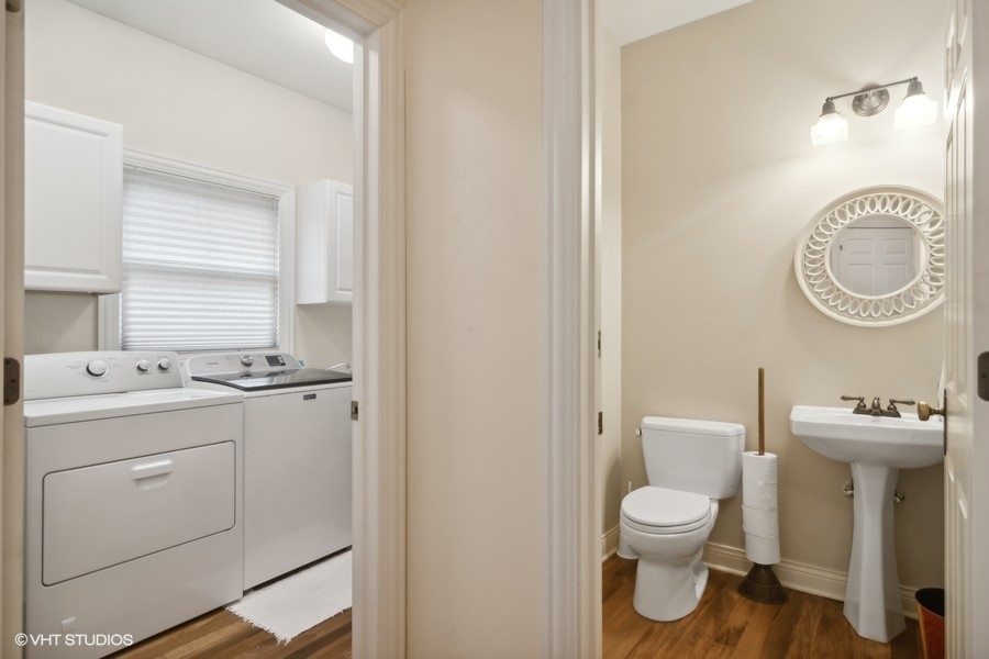 91 Roberts Road Inverness, IL 60067 - Photo 18 of 36 a bathroom with a toilet sink and mirror