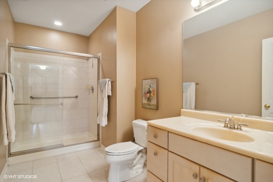91 Roberts Road Inverness, IL 60067 - Photo 24 of 36 a bathroom with a sink toilet and shower