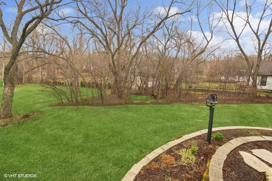 91 Roberts Road Inverness, IL 60067 - Photo 30 of 36 a view of a garden with a slide
