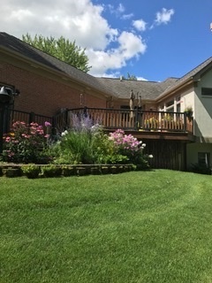 91 Roberts Road Inverness, IL 60067 - Photo 35 of 36 a view of a house with a big yard and potted plants