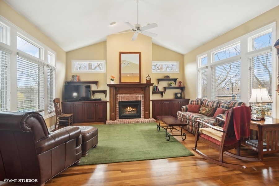 91 Roberts Road Inverness, IL 60067 - Photo 9 of 36 a living room with furniture fireplace and a large window