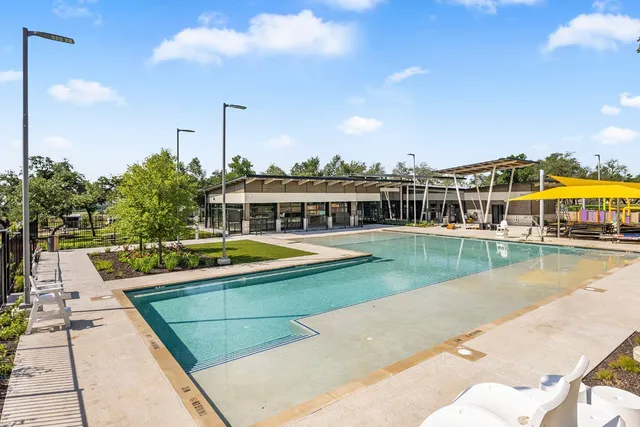 a view of a swimming pool with a lake view