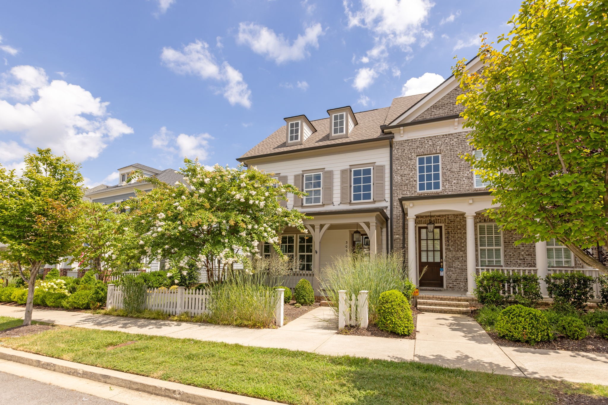 a front view of a house with garden