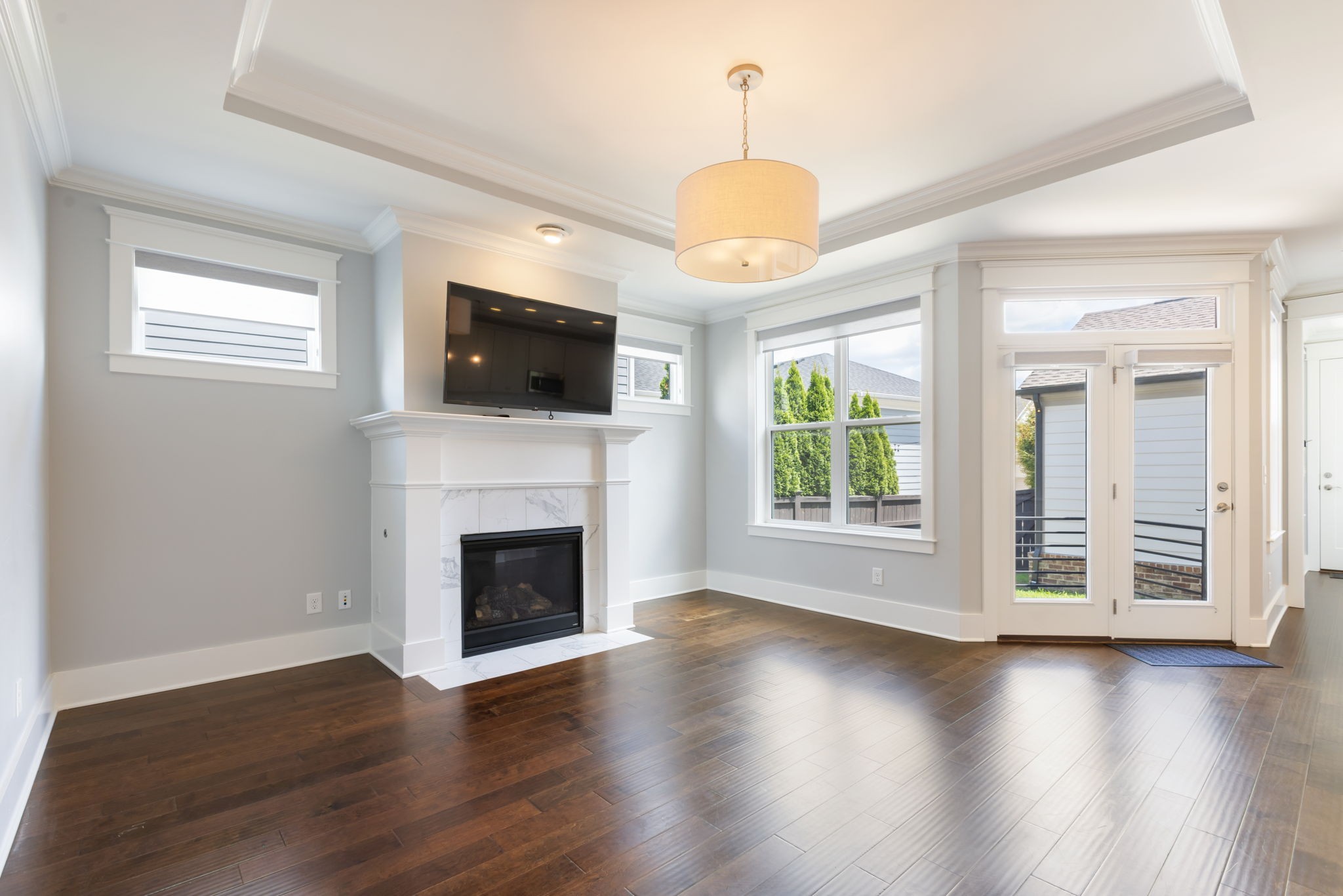 3091 Cheever Street Franklin, TN 37064 - Photo 16 of 36 a view of a livingroom with a fireplace wooden shelves and windows