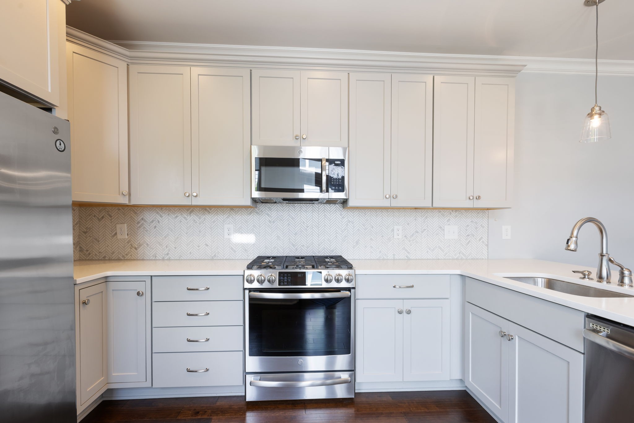 3091 Cheever Street Franklin, TN 37064 - Photo 19 of 36 a kitchen with white cabinets and stainless steel appliances