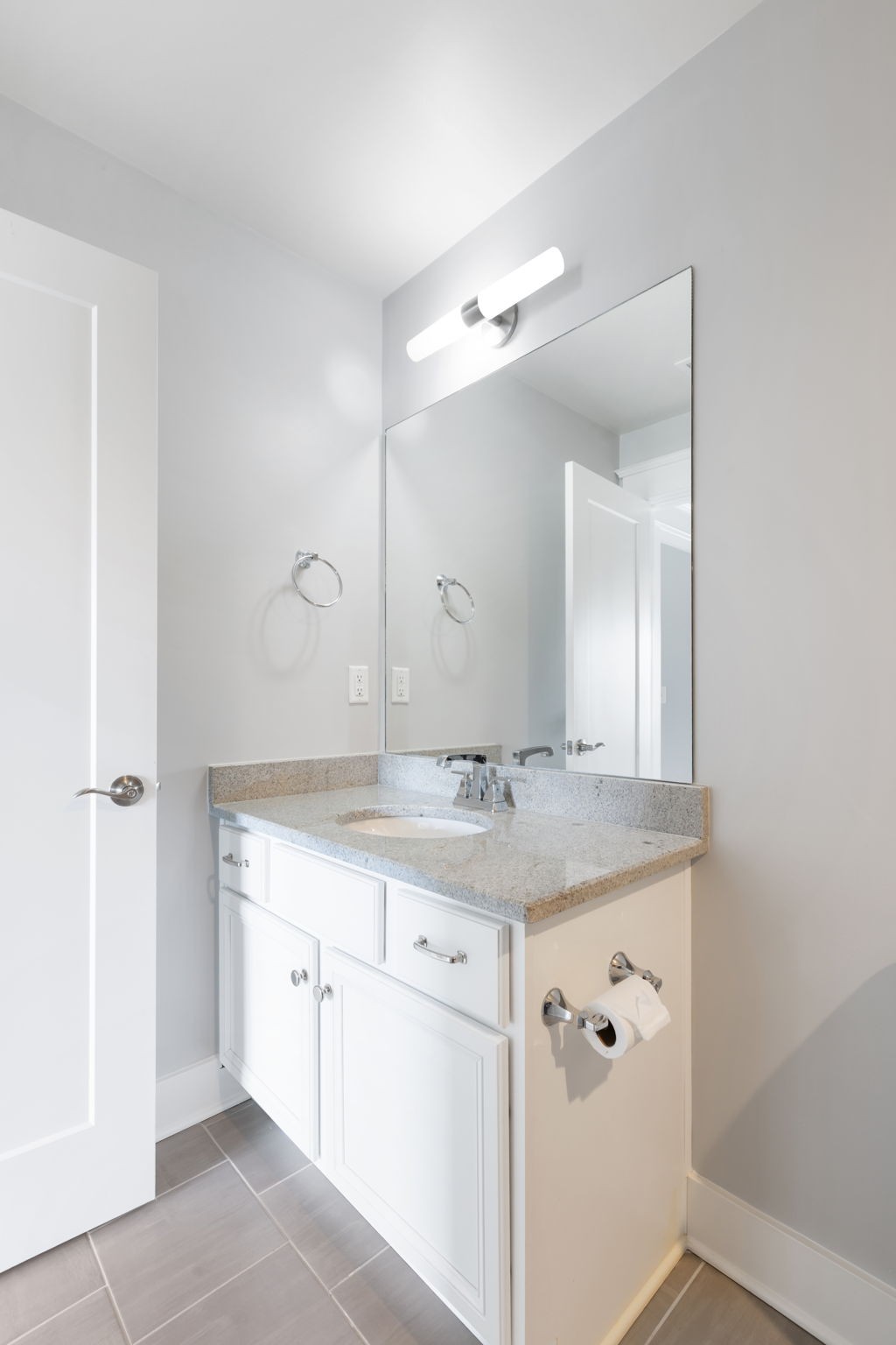 3091 Cheever Street Franklin, TN 37064 - Photo 30 of 36 a bathroom with a granite countertop sink a mirror and a