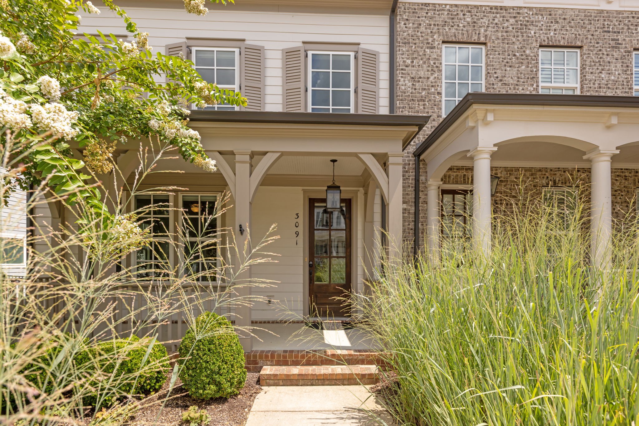 3091 Cheever Street Franklin, TN 37064 - Photo 4 of 36 a front view of a house with a garden