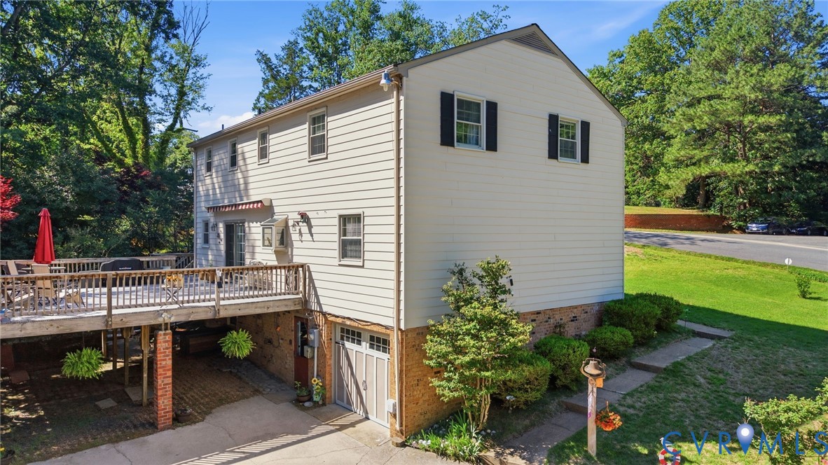 11200 Surry Road Chester, VA 23831 - Photo 3 of 48 a view of house with backyard and sitting area