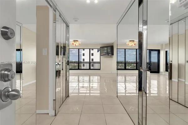 a view of an empty room with a window