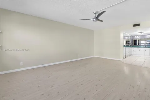 a living room with fireplace furniture and a wooden floor