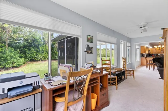 a view of a livingroom with furniture and a window