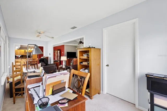a bedroom with furniture and a flat screen tv