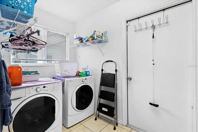 a living room with patio furniture and a yard