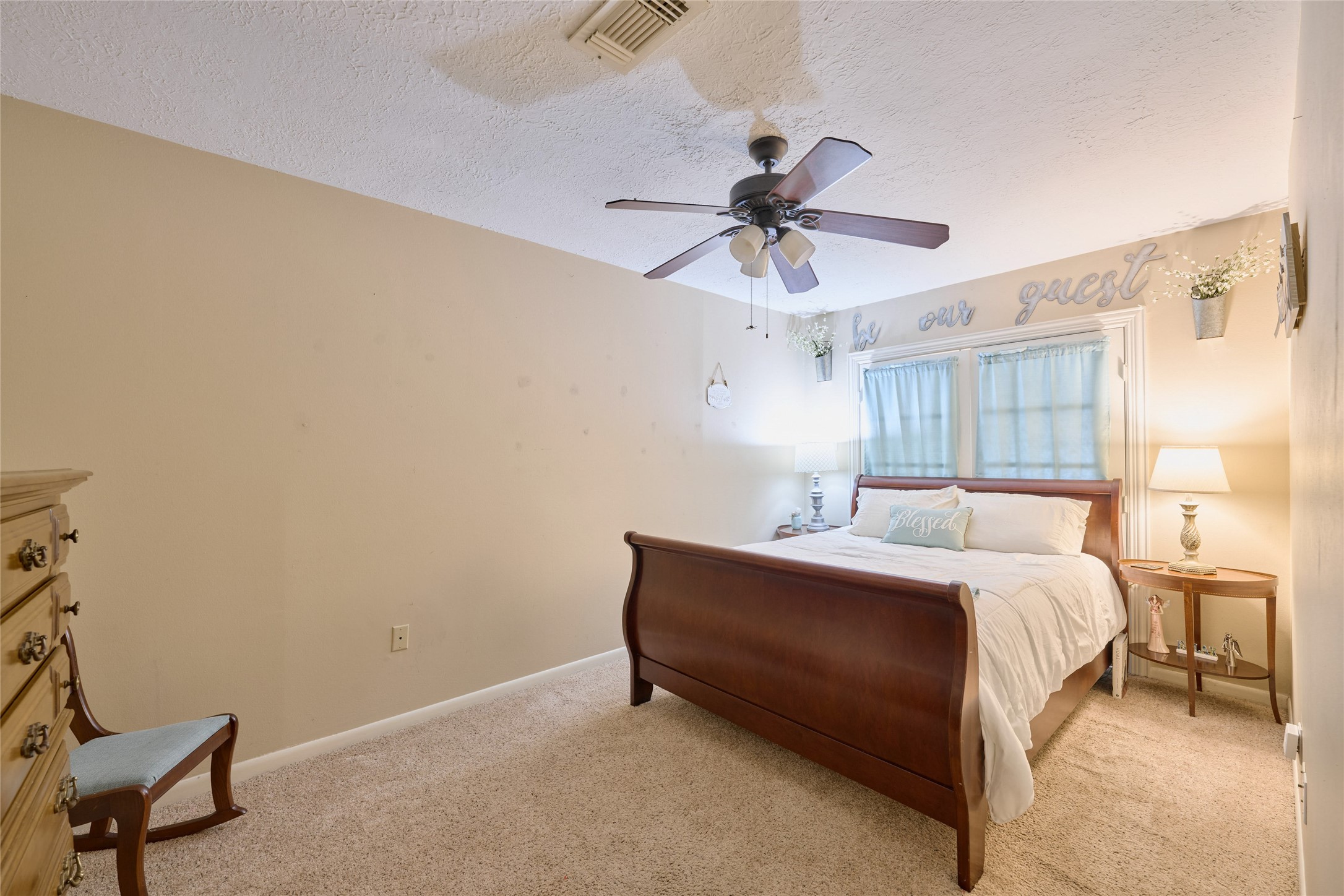 39 Regency Point Montgomery, TX 77356 - Photo 16 of 43 a bed room with a bed and a ceiling fan